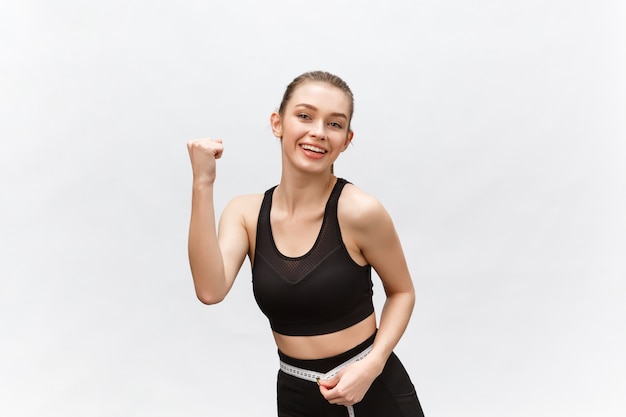 beautiful strong happy cheerful young sports woman posing