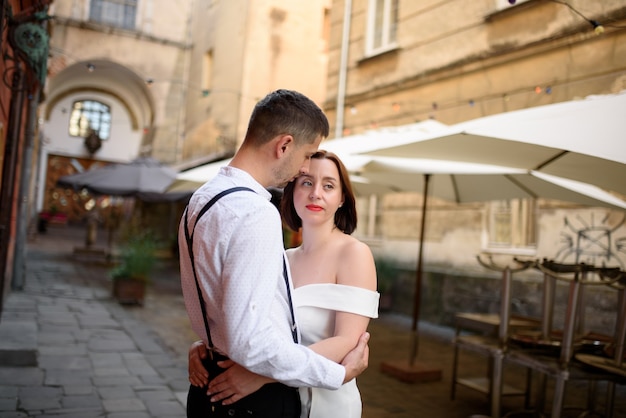 Beautiful stylish couple on a date on the streets in the old city.