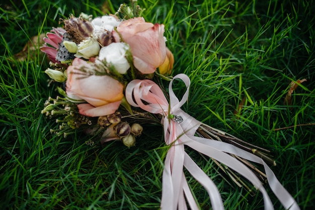 Beautiful stylish wedding bouquet close-up on the chair. Wedding Floristics.