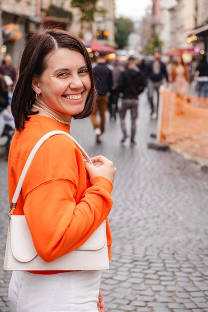 Beautiful stylish woman at european city street