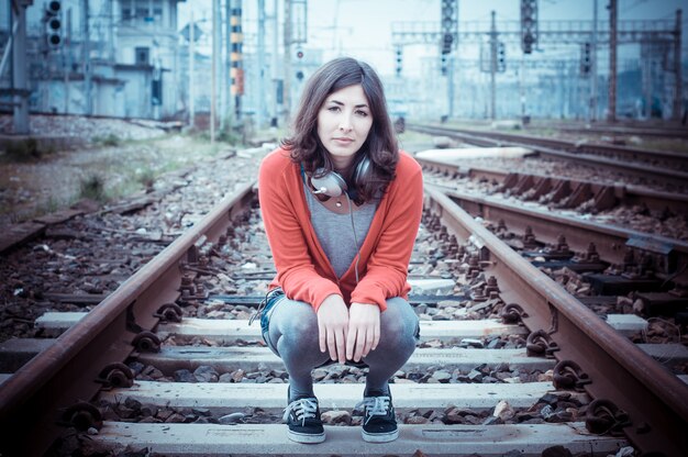 Beautiful stylish woman listening to music