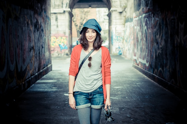 Beautiful stylish woman listening to music