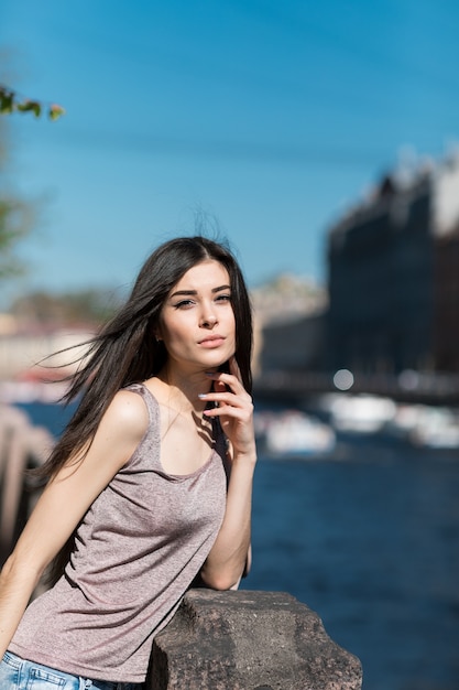 Beautiful stylish woman walking through the city