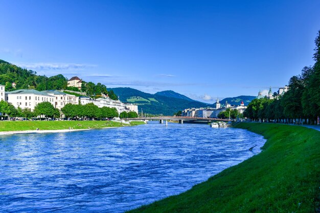 Beautiful summer day along the salzach river in salzburg austria