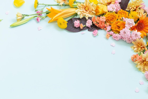 Beautiful summer flowers on blue background