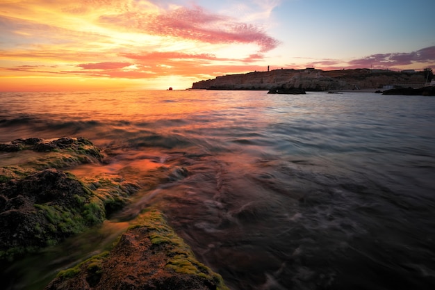 Beautiful summer landscape with sunset, colorful sky and sea. Composition of nature