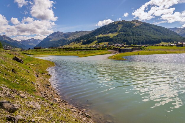 Beautiful summer landscape with vetta blesaccia mountain peak and lake livigno italy sunny day