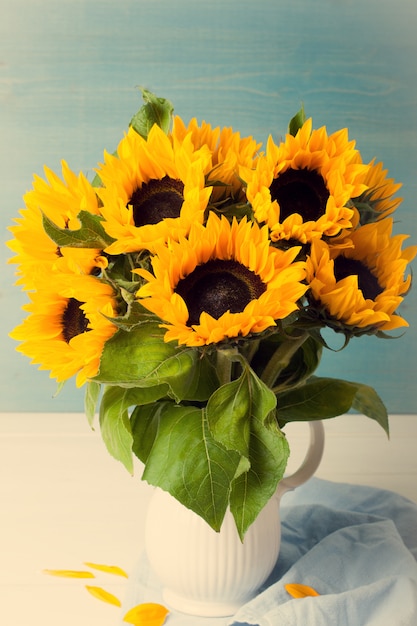 Beautiful sunflowers bouquet in white vase