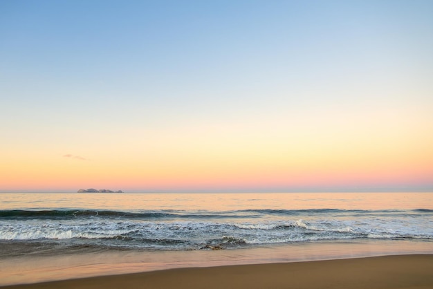 Beautiful sunny and pink sunrise on the beach