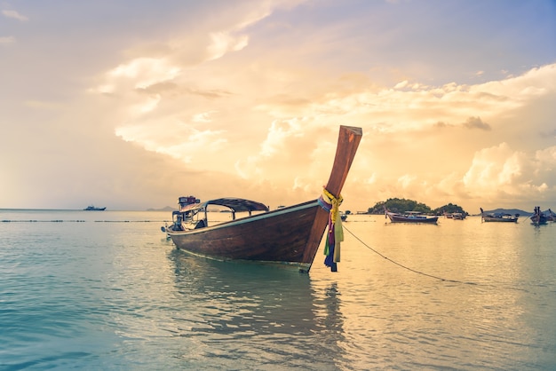 Beautiful sunrise long tailed fishing boat