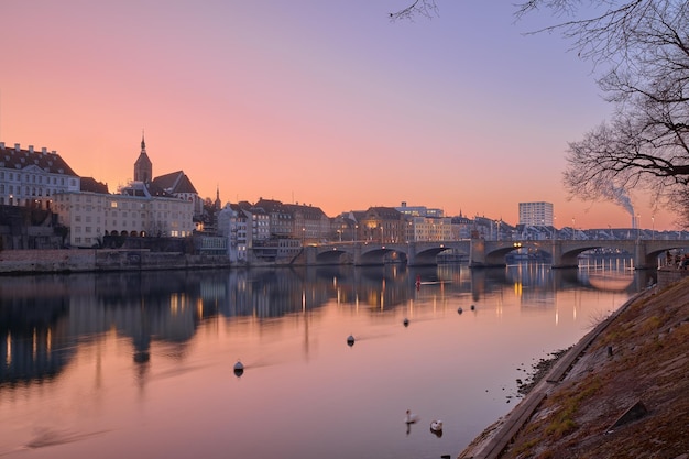 Beautiful sunset on the banks of the Rhine River in the city of Basel Switzerland