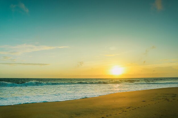 Beautiful sunset on the beach Nature background Toned