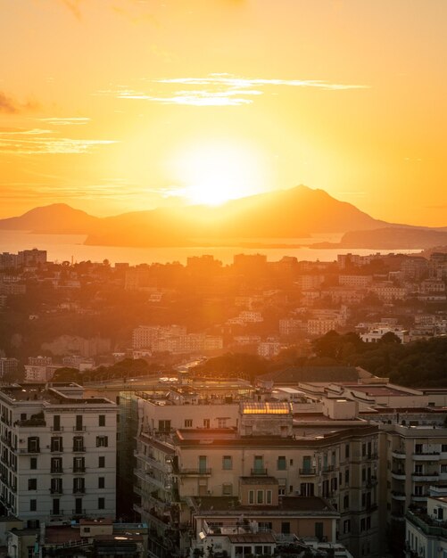 A beautiful sunset over a city with islands in the background