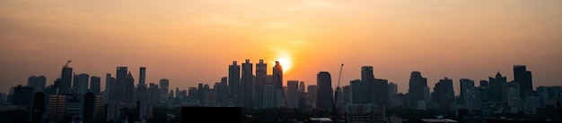 Beautiful sunset cityscape and highrise buildings in metropolis city center