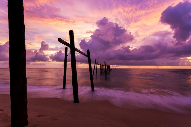Beautiful sunset Dramatic sky over sea with old wooden bridge at Khao Pilai in Phang- Nga Thailand