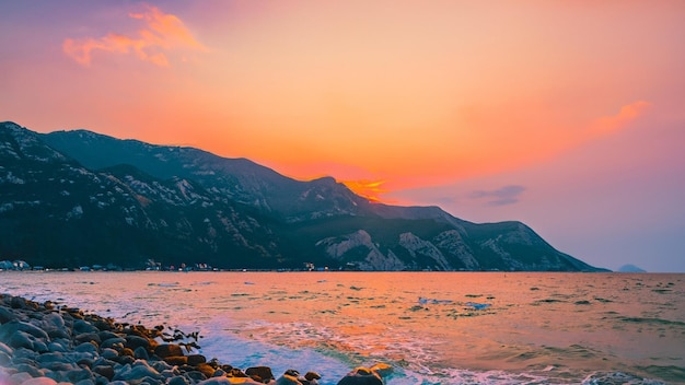 Beautiful sunset over the mountain around the beach