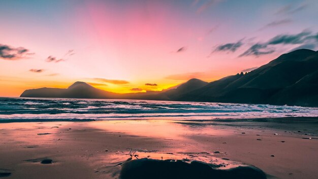 Beautiful sunset over the mountain around the beach