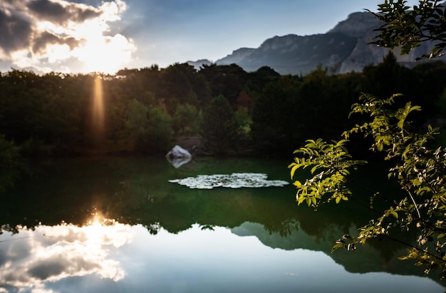 Beautiful sunset on a mountain lake suummer season