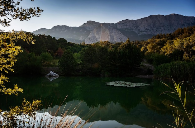 Beautiful sunset on a mountain lake suummer season