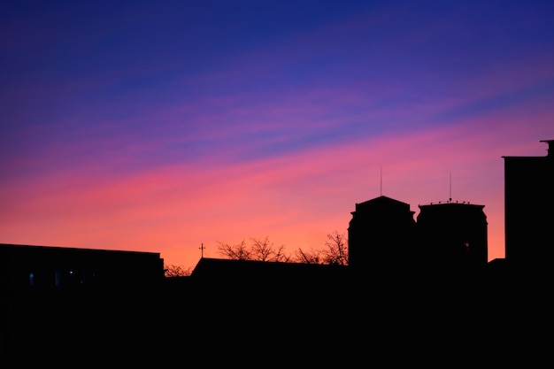 Beautiful sunset on the roof of the house