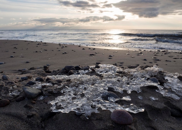 Beautiful sunset on the sandy beach of the Baltic Sea in Lietva Klaipeda