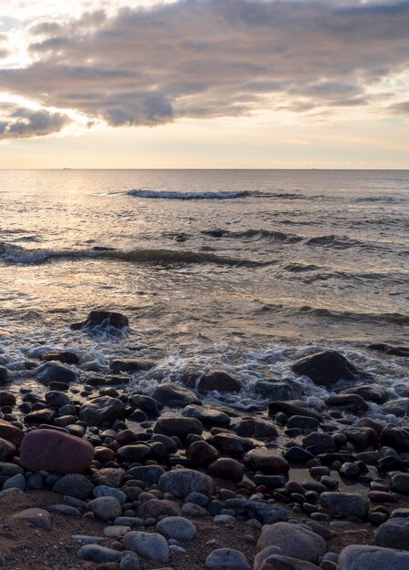 Beautiful sunset on the sandy beach of the Baltic Sea in Lietva Klaipeda