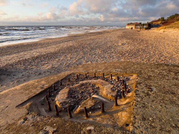 Beautiful sunset on the sandy beach and dunes of the Baltic Sea in Lithuania Klaipeda