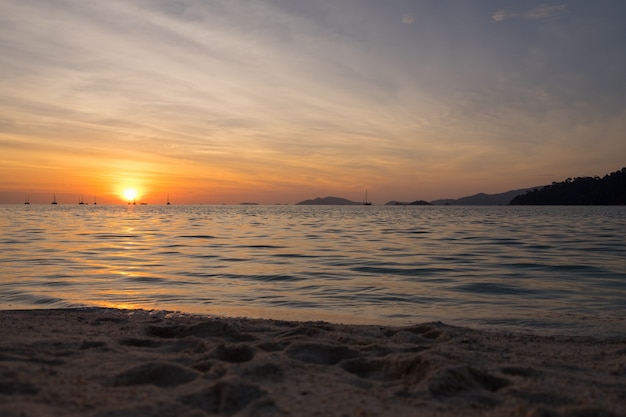 Beautiful sunset above the sea beach.