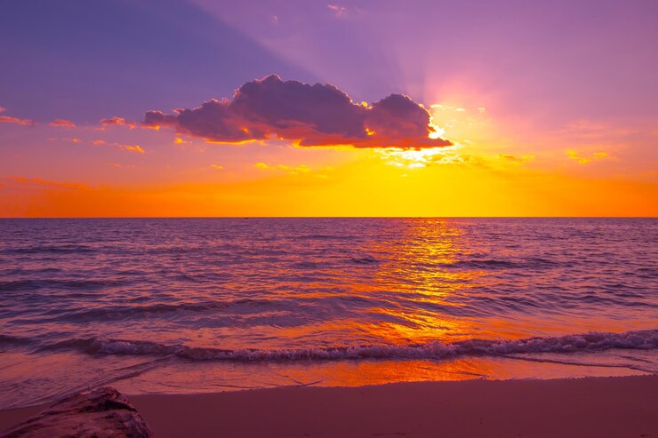 Photo beautiful sunset over the sea on the tropical beach with sky and clouds for travel in holiday relax time