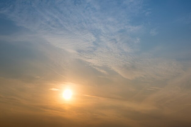 Beautiful sunset in the sky with clouds.