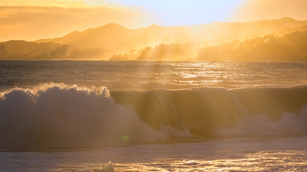 Beautiful sunset in Spain with big waves, Costa Brava