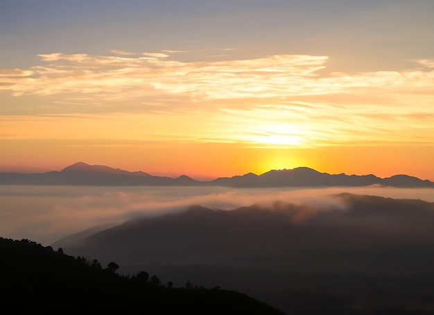 Beautiful Sunset and sunrise on sky and golden twilight time with mist and fog in valley of mountain