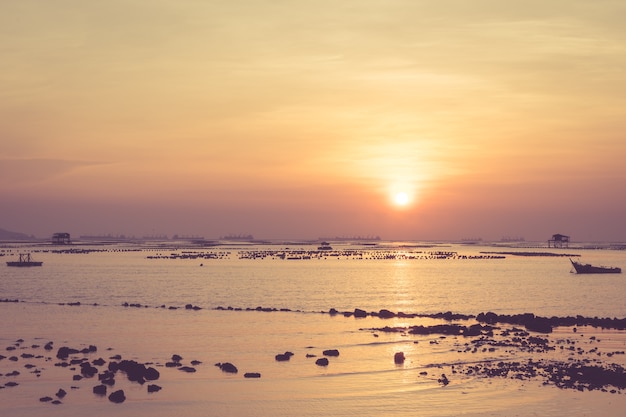 Beautiful Sunset Sunrise Sky over tropical sea landscape, vintage filter.