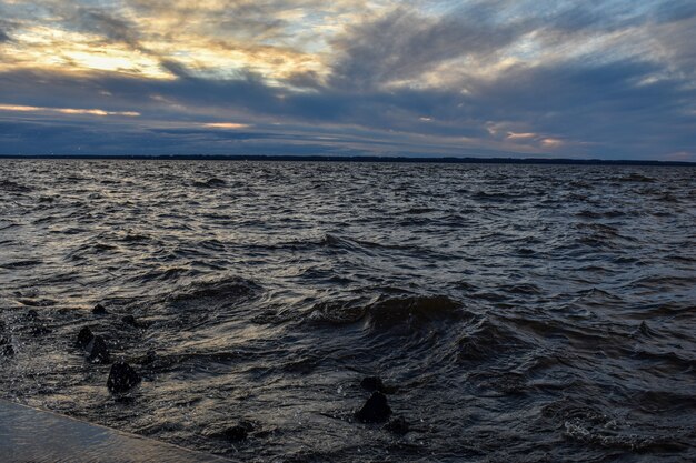 Beautiful sunset and waves on the Volga River