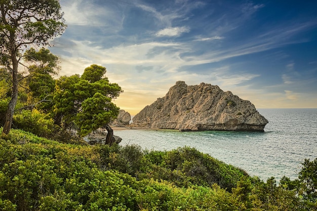 Beautiful sunset over wild beach Mediterrenian sea Greece