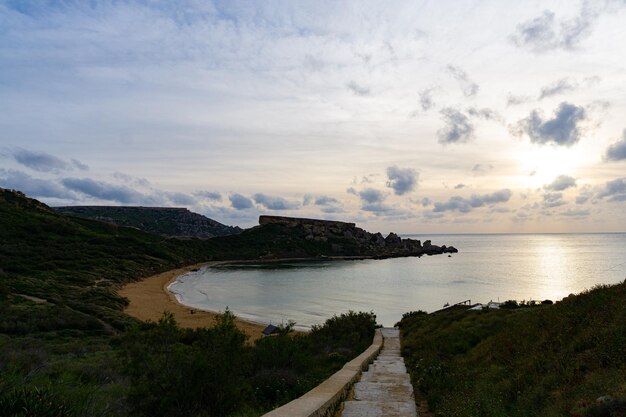 Beautiful sunset with clouds and a calm sea in Malta