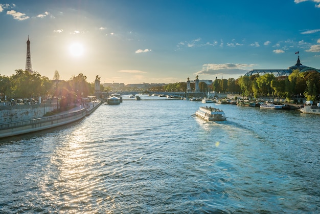 Beautiful sunset with Eiffel Tower and Seine river in Paris, France