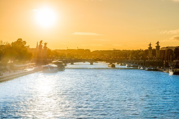 Beautiful sunset with Eiffel Tower and Seine river in Paris, France