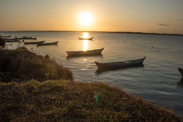 Beautiful sunset with several boats on the river