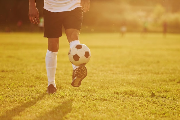 Beautiful sunshine Young soccer player have training on the sportive field