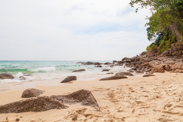 Beautiful Surin beach in Choeng Thale city Phuket Thailand with white sand turquoise water and palm trees