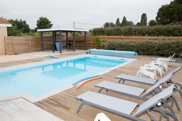 Beautiful swimming pool close to a modern house