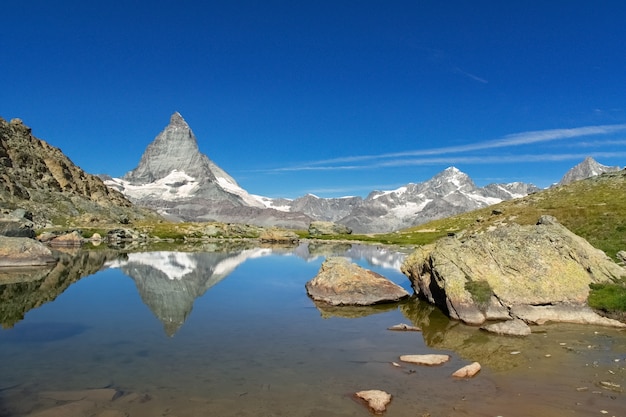 Beautiful Swiss Alps landscape with Stellisee lake and Matterhorn mountain reflection in water