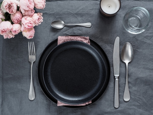 Beautiful table setting on gray linen tablecloth.