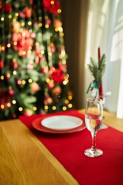 Beautiful table setting with Christmas decorations in living room