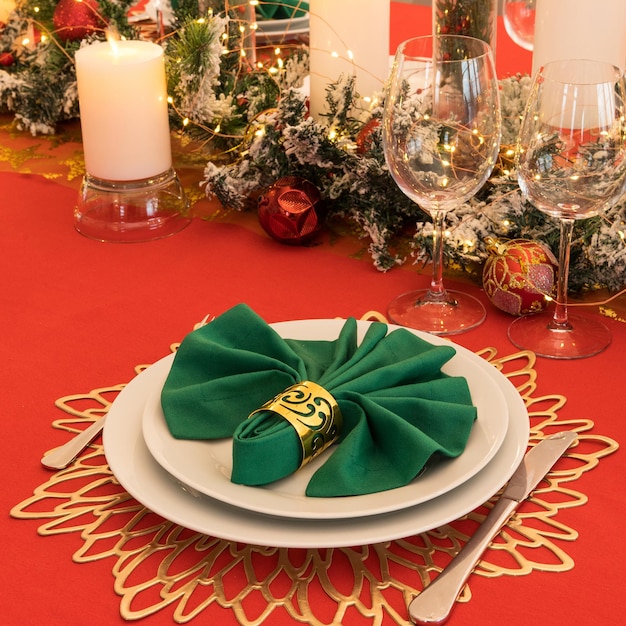 Beautiful table setting with Christmas decorations Red colors