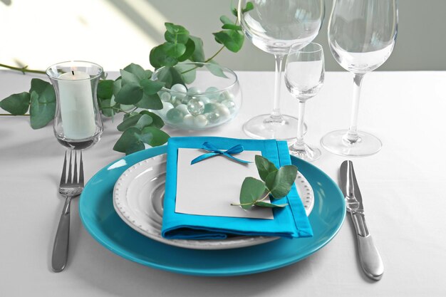 Photo beautiful table setting with silver flatware