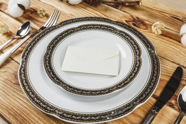 Beautiful table setting on wooden table from above