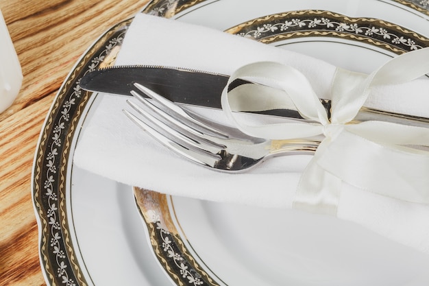 Beautiful table setting on wooden table from above