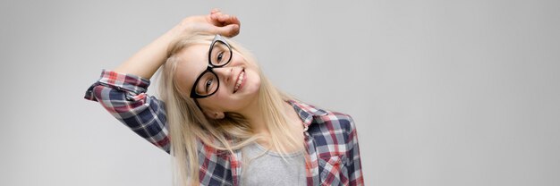 Beautiful teen girl with long hair and wearing glasses. 